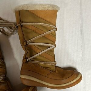 Fubu fleece lined, leather upper winter boot. Tall, lace up.